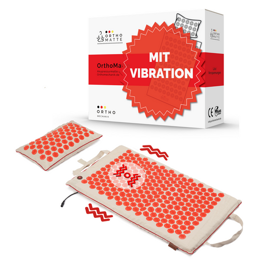 Akupressurmatte und Kissen mit roten Massagepunkten und Vibrationsfunktion, inklusive Verpackung mit der Aufschrift ‚Mit Vibration‘